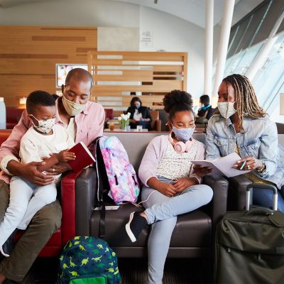 A family enjoys relaxing in the Admirals Club®