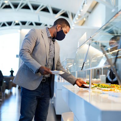 A businessman enjoys a meal at the Flagship Lounge
